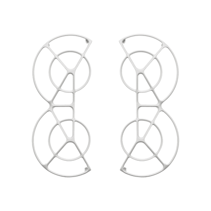 Pair of white earrings with geometric design on a black background