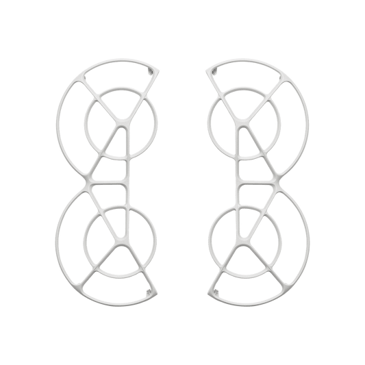 Pair of white earrings with geometric design on a black background