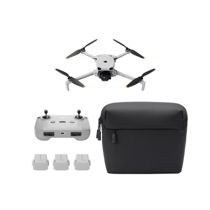 Drone with controller, battery packs, and carrying case on a transparent background