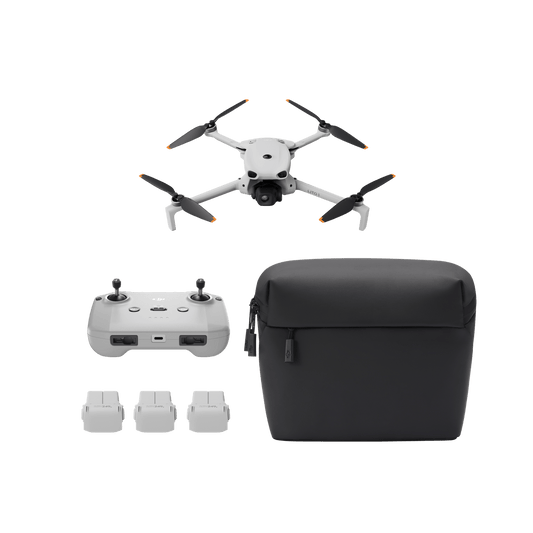 Drone with controller, battery packs, and carrying case on a transparent background