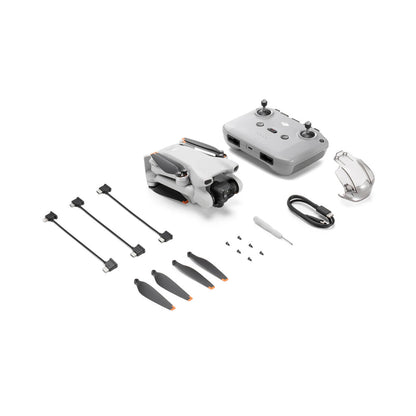 DJI Mini 3 drone and accessories on a white background