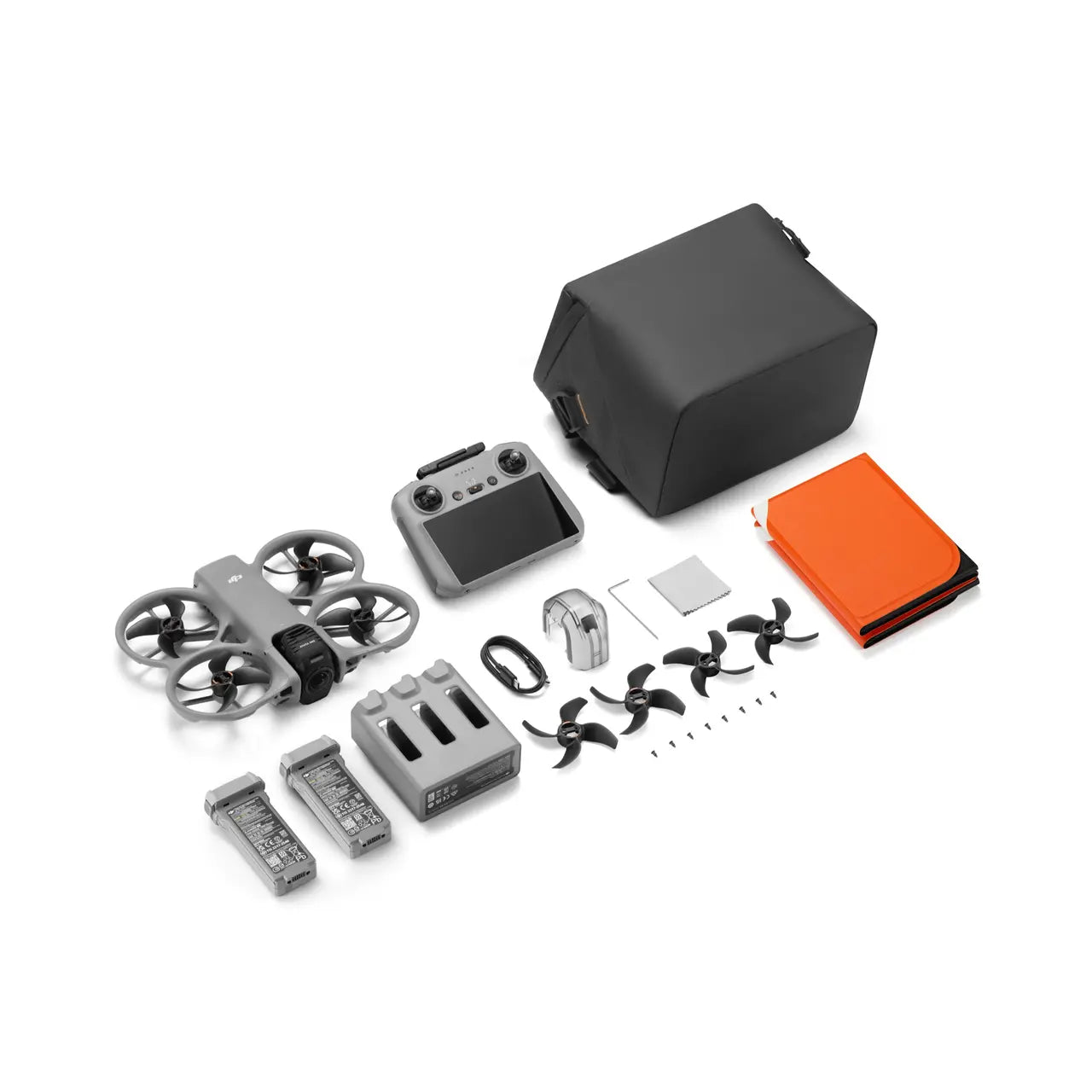 Collection of drone parts including a drone, battery, propellers, and accessories on a white background.