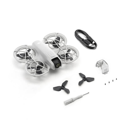 DJI Neo White drone with propellers and tools on a white background