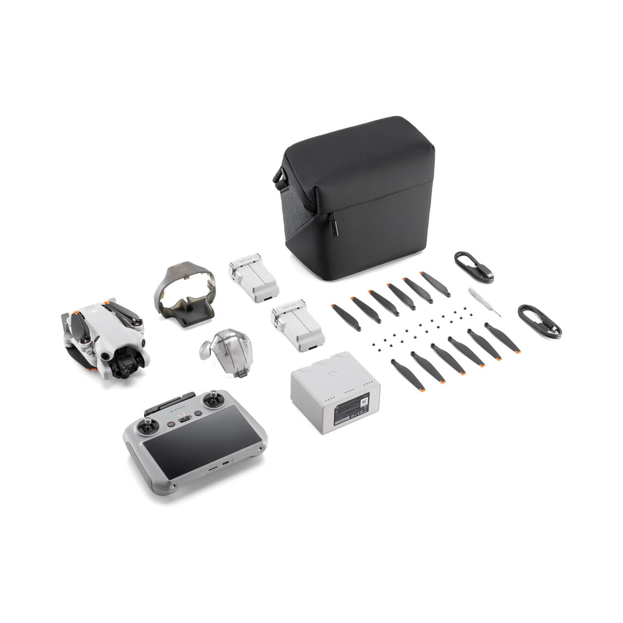Collection of DJI mini 4 pro fly more combo drone parts and accessories on a white background