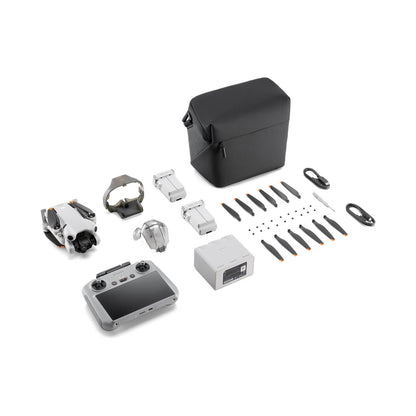 Collection of DJI mini 4 pro fly more combo drone parts and accessories on a white background
