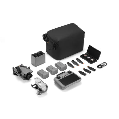 Collection of drone accessories including a black bag, remote control, and various parts on a white background.