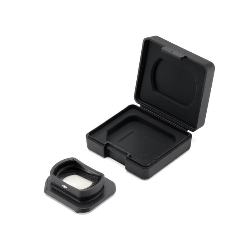 Black camera lens cover with open case on a white background