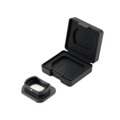 Black camera lens cover with open case on a white background