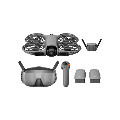 Collection of drone components including a drone, goggles, remote control, and accessories on a black background.