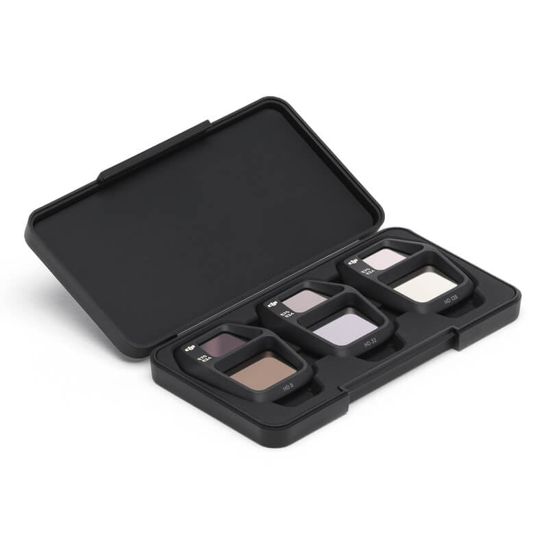 Black makeup palette with four compartments on a white background