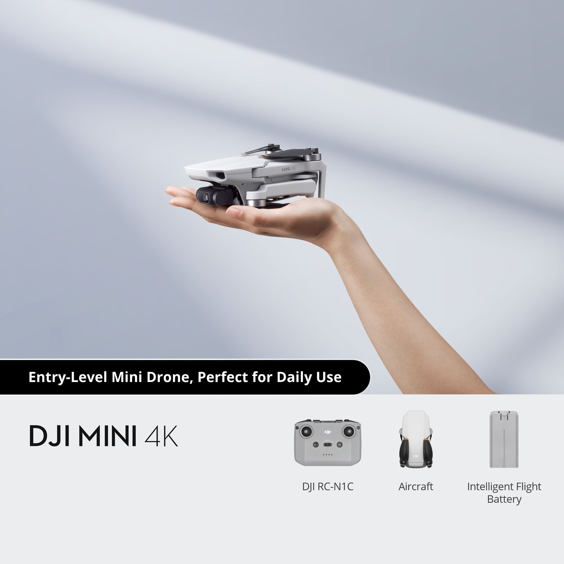 DJI Mini 4K drone held in a hand with product components displayed below on a light gray background