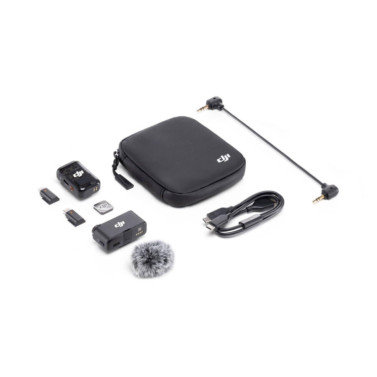 Collection of DJI Mic 2 accessories including a case, cable, and small electronic components on a white background.