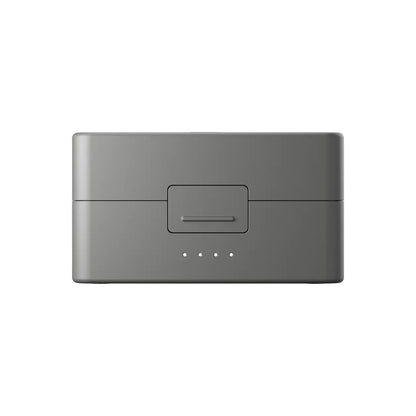 Gray DJI mic 3 device with power indicator on a white background