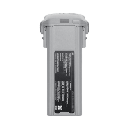 Gray battery pack with a label on a white background