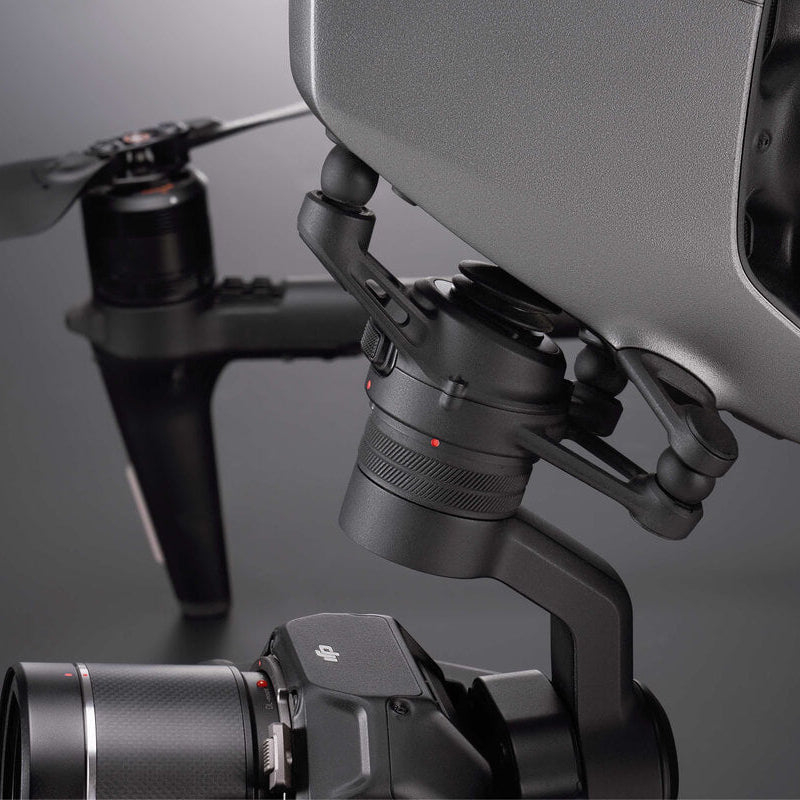 Close-up of a drone with camera and gimbal on a reflective surface