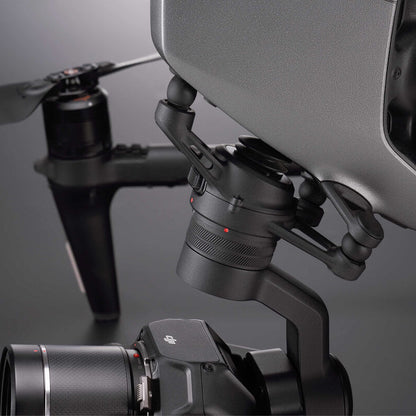 Close-up of a drone with camera and gimbal on a reflective surface