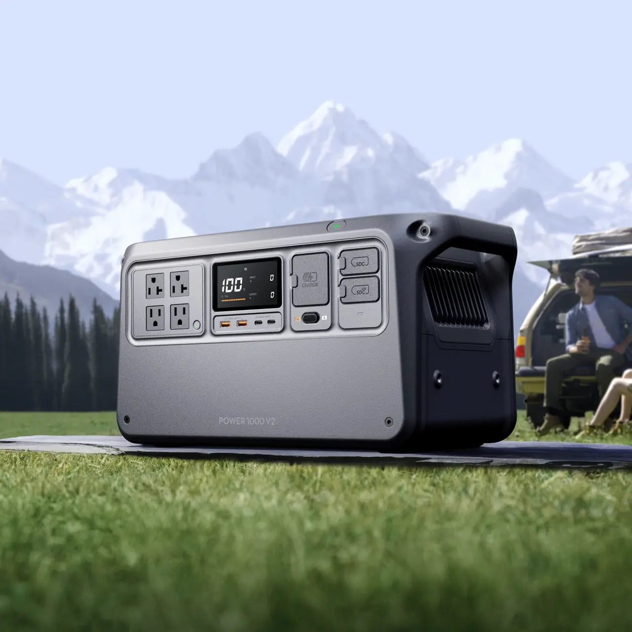 Portable power station on grass with mountains in the background