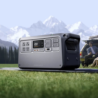 Portable power station on grass with mountains in the background