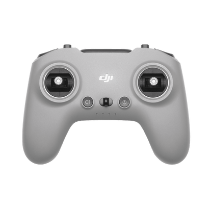 Gray DJI remote control on a black background