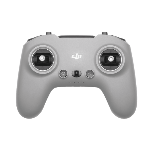 Gray DJI remote control on a black background