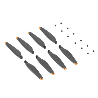 Set of gray cylindrical objects with orange accents on a white background