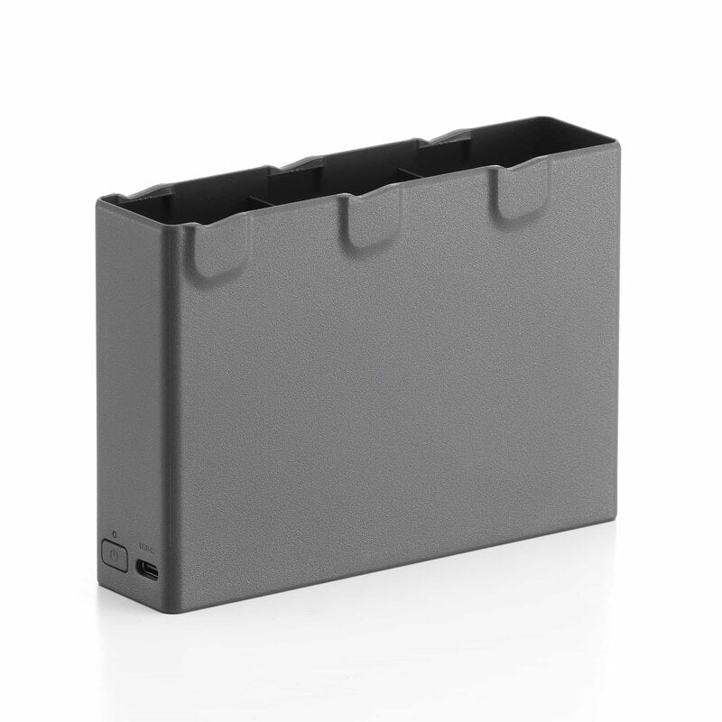 Gray electronic device with a black top on a white background