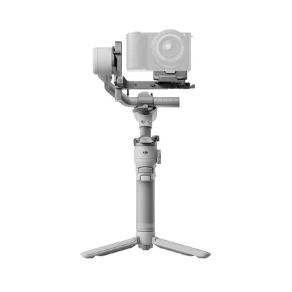 DJI RS 4 Mini Camera stabilizer with a camera attached on a white background