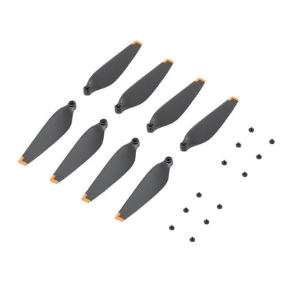 Set of gray drone propellers with small black screws on a white background