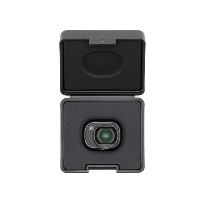 Black camera lens with protective cover on a white background