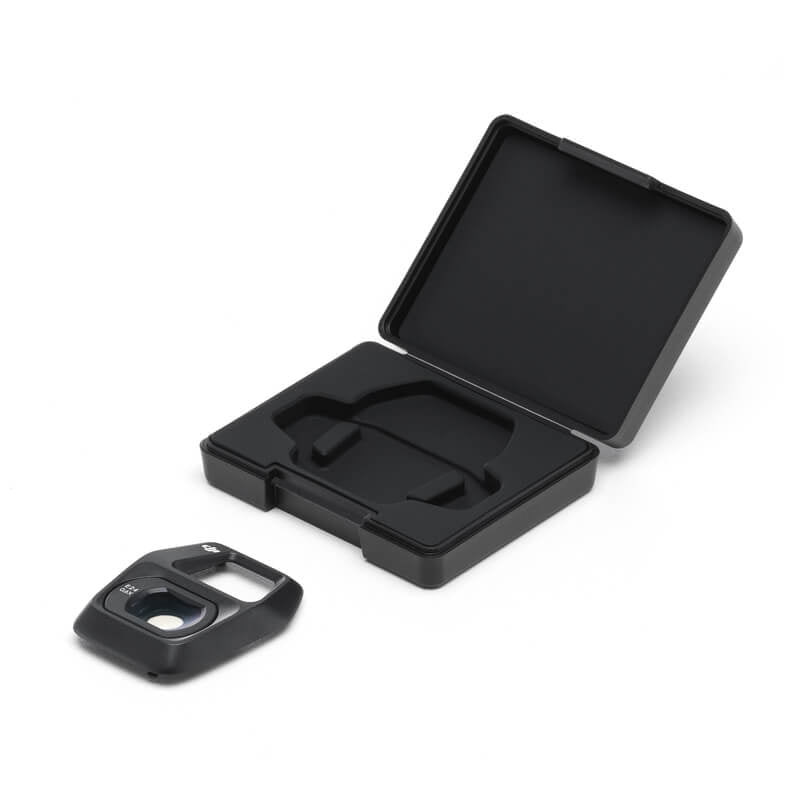 Black plastic case with a lid and a small black component on a white background