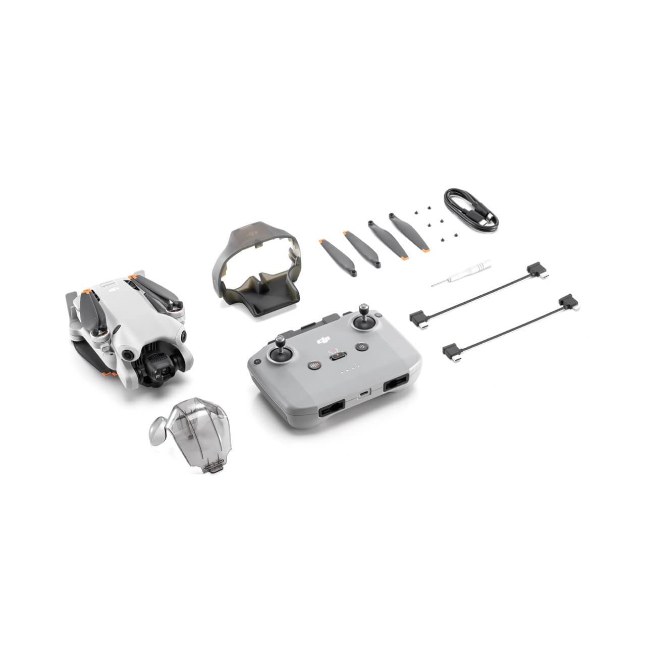 DJI Mini 4 pro drone and accessories on a white background