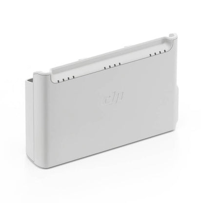 White electronic device with 'DJI' branding on a white background