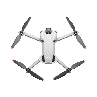 DJI mini 4 pro drone with four propellers on a white background