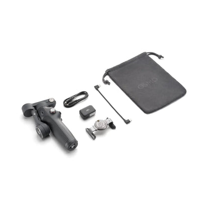 Collection of camera accessories including a handle, lens, and carrying pouch on a white background