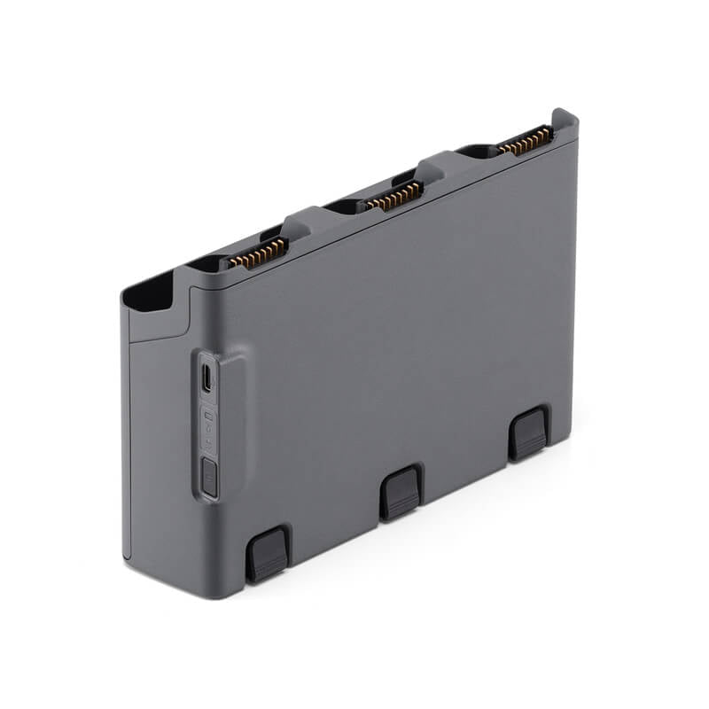 Gray rectangular battery pack with connectors on a white background