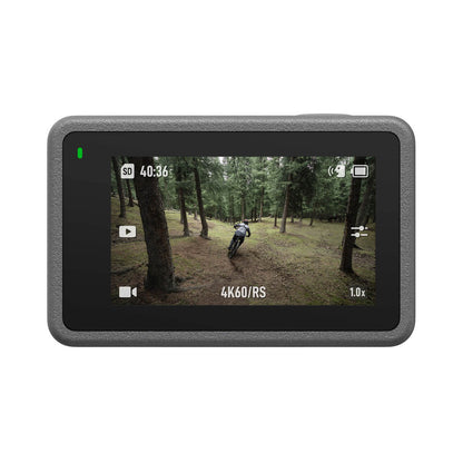 Action camera display showing a forest scene with a cyclist.