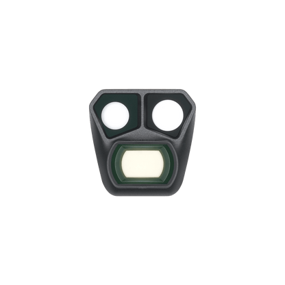 Black night vision device with two white lenses and a green filter on a black background