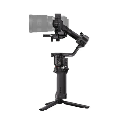 Camera stabilizer with a camera attached on a white background