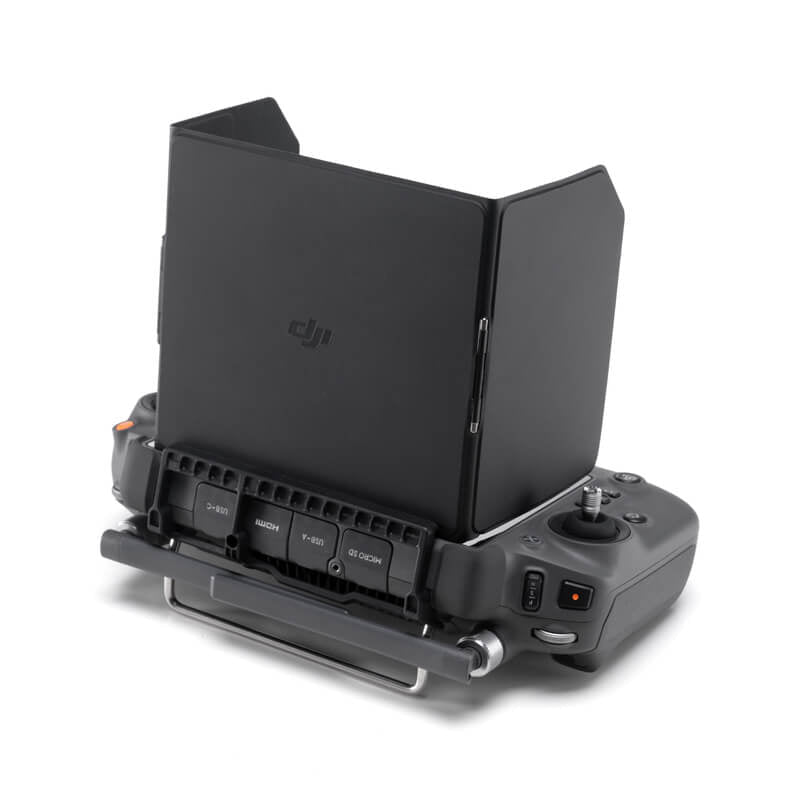 Black DJI device with screen on a white background