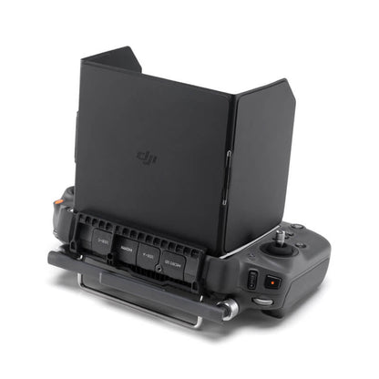 Black DJI device with screen on a white background