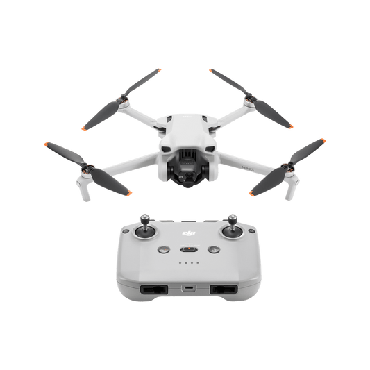 DJI mini 3 White drone with four propellers and a remote control on a black background