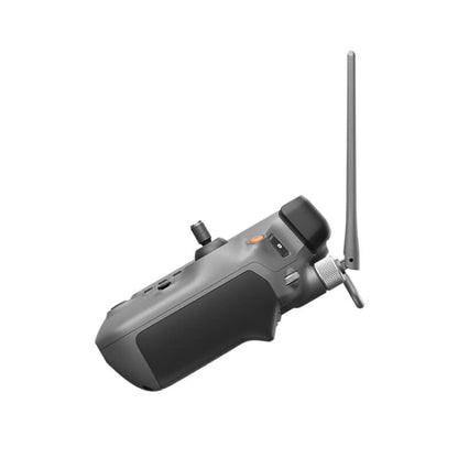 Gray remote control device with antenna on a white background